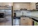 Modern kitchen featuring stainless steel appliances, countertops, and sleek backsplash at 120 S Pennsylvania St # 302, Denver, CO 80209