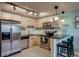 Modern kitchen featuring stainless steel appliances and sleek cabinetry at 120 S Pennsylvania St # 302, Denver, CO 80209