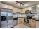 Bright kitchen featuring stainless steel appliances, stylish cabinetry and plenty of counter space at 120 S Pennsylvania St # 302, Denver, CO 80209