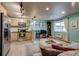 Cozy living area showcasing a well-equipped kitchen and comfortable lounge space at 120 S Pennsylvania St # 302, Denver, CO 80209
