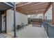 Cozy back patio area with dining set, bike storage, and access to the building at 120 S Pennsylvania St # 302, Denver, CO 80209