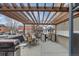 Outdoor patio with pergola, dining set, and grill perfect for entertaining guests at 120 S Pennsylvania St # 302, Denver, CO 80209