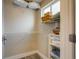 Walk-in closet with wire shelving and a window for ample storage and natural light at 120 S Pennsylvania St # 302, Denver, CO 80209