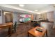 Entertainement room with hardwood floors and ping pong table with a comfortable seating area at 8722 S Ault Ln, Morrison, CO 80465