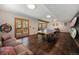 Recreational room area featuring a ping pong table and an exterior door to the backyard at 8722 S Ault Ln, Morrison, CO 80465