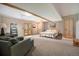 Spacious bedroom with seating area and a door that leads to an outside balcony at 8722 S Ault Ln, Morrison, CO 80465