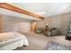 Large bedroom featuring seating and a door leading to an outdoor area at 8722 S Ault Ln, Morrison, CO 80465