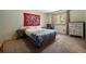 Bedroom with natural light, a bed, and side tables at 8722 S Ault Ln, Morrison, CO 80465