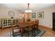 Inviting dining room features a wooden table set and elegant decor at 8722 S Ault Ln, Morrison, CO 80465
