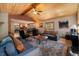 Spacious living room offering a cozy ambiance with wood ceilings and an open floor plan at 8722 S Ault Ln, Morrison, CO 80465
