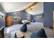 Spacious main bedroom featuring vaulted ceilings, large windows, and comfortable seating area at 8722 S Ault Ln, Morrison, CO 80465