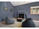 Sitting area in main bedroom with fireplace and comfortable seating at 8722 S Ault Ln, Morrison, CO 80465