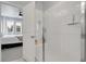 Modern bathroom with a tiled walk-in shower and glass door at 12738 Boggs St, Parker, CO 80134