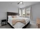 Serene bedroom with a king bed, plush bedding, and bright natural light from multiple windows at 12738 Boggs St, Parker, CO 80134