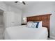 Bedroom featuring a wooden headboard bed, and a side table with a lamp at 12738 Boggs St, Parker, CO 80134