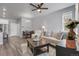 Bright living room boasts modern furniture, neutral colors, and an open layout for comfortable living at 12738 Boggs St, Parker, CO 80134
