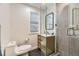 Updated bathroom features a modern sink, gray shower tile, and black geometric floor tiles at 1600 S Quebec Way # 8, Denver, CO 80231