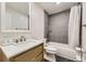 Bathroom featuring modern fixtures, tiled shower, and stylish vanity at 1600 S Quebec Way # 8, Denver, CO 80231