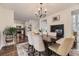 Dining room area with hardwood floors, views to kitchen and modern decor at 1600 S Quebec Way # 8, Denver, CO 80231