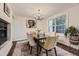 Bright dining room featuring a chandelier, natural light, and stylish decor at 1600 S Quebec Way # 8, Denver, CO 80231