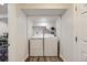 Convenient laundry area featuring modern white washer and dryer units in a cozy space at 1600 S Quebec Way # 8, Denver, CO 80231