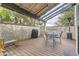 Relaxing outdoor space with grilling station, a table and chairs, and lush greenery at 1600 S Quebec Way # 8, Denver, CO 80231