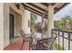Charming patio with wrought iron table and chairs, perfect for outdoor dining and relaxation at 1600 S Quebec Way # 8, Denver, CO 80231