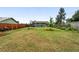 Exterior of a home with a large, green backyard with mature trees and landscaping at 2011 S Vallejo St, Denver, CO 80223