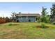 Exterior view of home with a well-manicured lawn and privacy fence at 2011 S Vallejo St, Denver, CO 80223