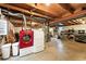 Spacious basement with laundry area and exposed beams ready to be personalized at 2011 S Vallejo St, Denver, CO 80223