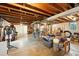 Unfinished basement featuring exposed wooden beams and concrete floors at 2011 S Vallejo St, Denver, CO 80223