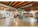 Open basement with concrete floor and exposed ceiling awaiting personalization at 2011 S Vallejo St, Denver, CO 80223