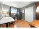 Bedroom setup as office featuring modern desk, office chair, and a closet at 2011 S Vallejo St, Denver, CO 80223