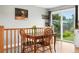 Cozy dining area with hardwood floors and a sliding glass door offering backyard views at 2011 S Vallejo St, Denver, CO 80223