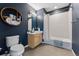 Stylish bathroom with updated shower, wooden cabinet and round decorative shelf at 1820 Mary Ln # 1, Boulder, CO 80304
