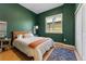 Bright bedroom with hardwood floors, a large window, and tasteful furnishings at 1820 Mary Ln # 1, Boulder, CO 80304