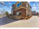 Corner unit with brick and composite exterior, landscaping and attached parking at 1820 Mary Ln # 1, Boulder, CO 80304