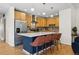 Stylish kitchen featuring a large island with seating, stainless steel appliances, and sleek countertops at 1820 Mary Ln # 1, Boulder, CO 80304