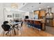 Open concept with kitchen island, dining table and living room area with hardwood flooring at 1820 Mary Ln # 1, Boulder, CO 80304