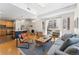 Open-concept living room featuring hardwood floors, modern decor, and abundant natural light from large windows at 1820 Mary Ln # 1, Boulder, CO 80304