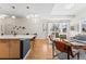 Bright living space with hardwood floors, island seating, and view to the patio at 1820 Mary Ln # 1, Boulder, CO 80304