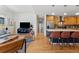 Open-concept living space with hardwood floors, island seating, and a cozy living room at 1820 Mary Ln # 1, Boulder, CO 80304