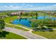 Aerial view showcases community pond, walking paths, landscaping, and neighborhood homes at 15720 Columbus Mountain Dr, Broomfield, CO 80023