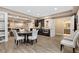 Open concept basement featuring a bar area with modern appliances and a dining area at 15720 Columbus Mountain Dr, Broomfield, CO 80023