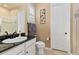 Clean bathroom featuring granite counters, a shower with glass door and bright lighting at 15720 Columbus Mountain Dr, Broomfield, CO 80023