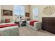 Cozy bedroom with two beds, neutral walls, and a view from the windows at 15720 Columbus Mountain Dr, Broomfield, CO 80023