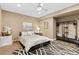 Stylish bedroom with a modern decor, art, and a comfortable bed at 15720 Columbus Mountain Dr, Broomfield, CO 80023