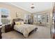 Spacious main bedroom with tray ceilings, bay windows, and ample natural light at 15720 Columbus Mountain Dr, Broomfield, CO 80023