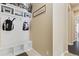 Inviting mudroom with white shelving, bench, storage baskets, and coat hooks, perfect for organization at 15720 Columbus Mountain Dr, Broomfield, CO 80023
