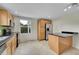 Bright kitchen with stainless appliances, an island, and ample cabinet space at 1720 Trenton St, Denver, CO 80220